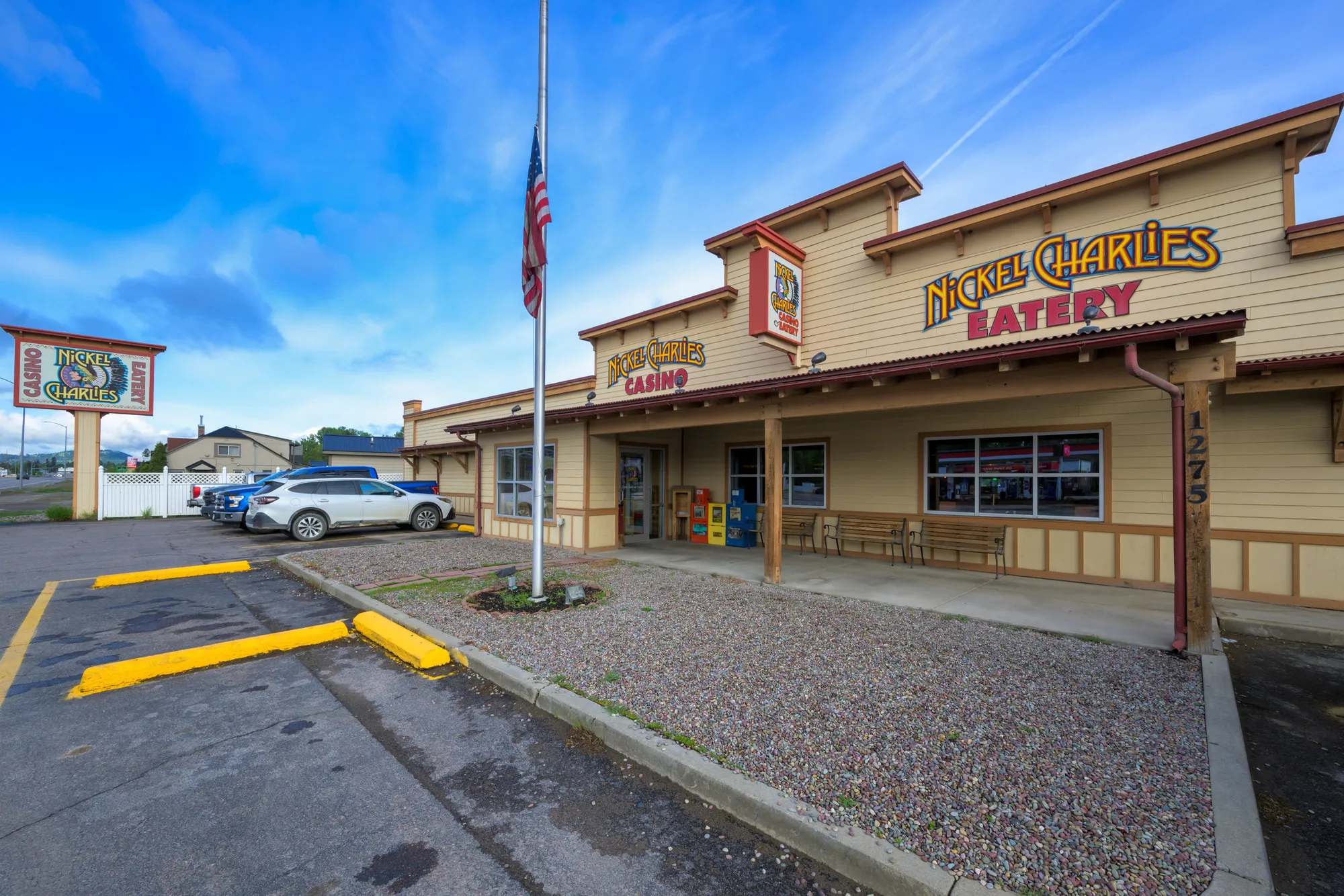 Restaurant and casino building with a parking lot