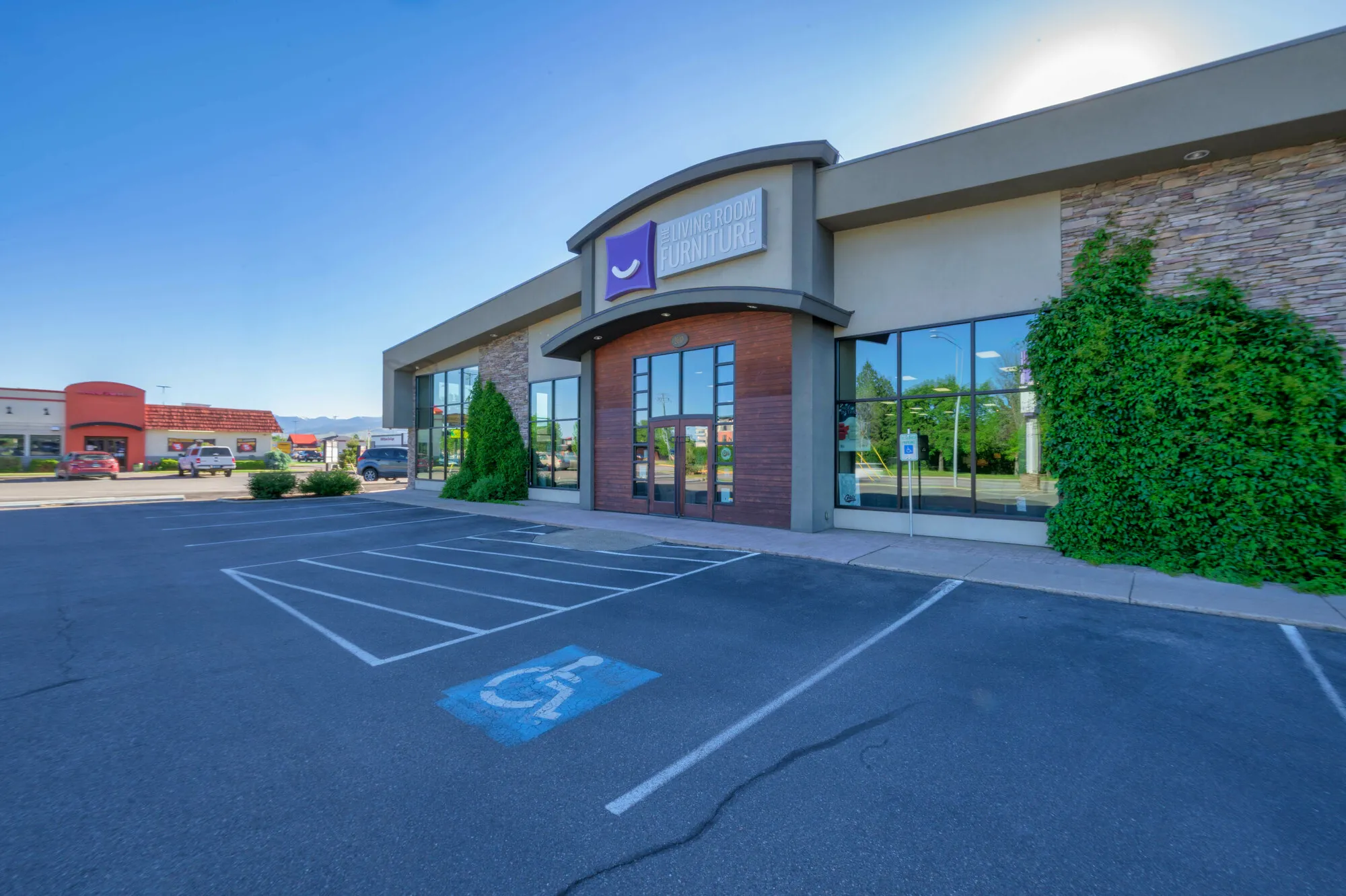 Single-story retail building with a parking lot